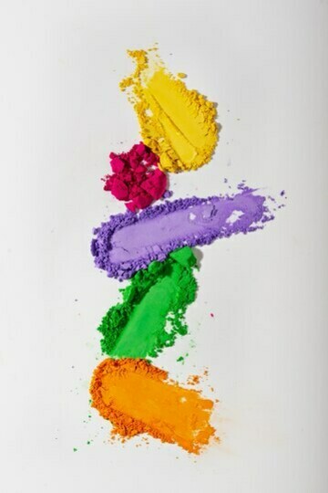 Colorful eyeshadow palettes viewed from above on a white background
