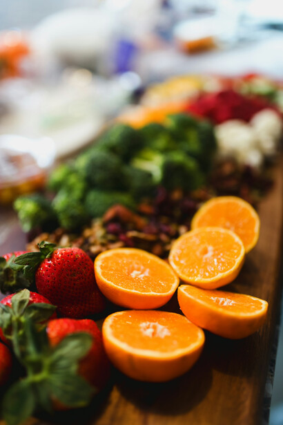 Assorted fruits and vegetables on a chopping board