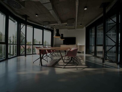 A deserted conference room gives the impression that without people at work this space and room would be redundant