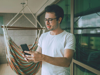 His bright expression reflects the satisfaction of engaging with a thoughtfully curated feed that enhances his mood and well-being