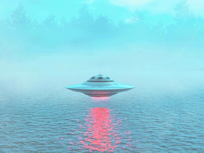 A cruising UFO over a lake in a secluded area in what appears to be a forest