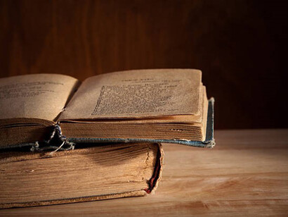 An open book on a wooden table