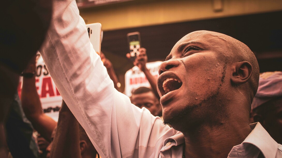 A black man in a crowd, protesting