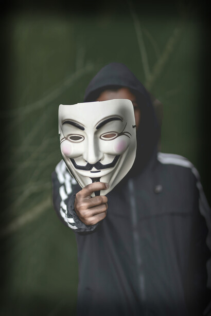 A masked figure represents the fragmentation of the self