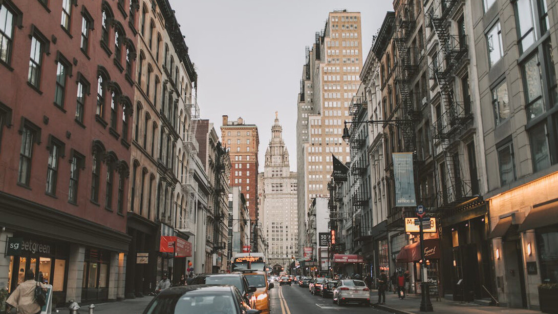 The vibrant streets of New York City, United States, come alive with the hustle and bustle of people and taxis, embodying the city's dynamic energy and allure