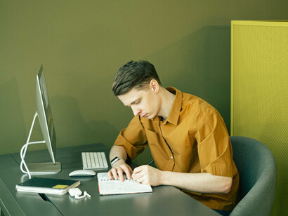 Focused and determined, he reflects on how the current era of technological advancement and global connectivity has transformed the way we work and innovate