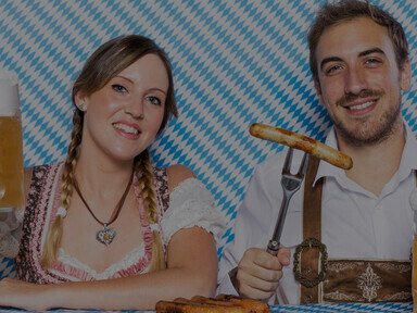 Young couple celebrating with beer, enjoying a lively moment