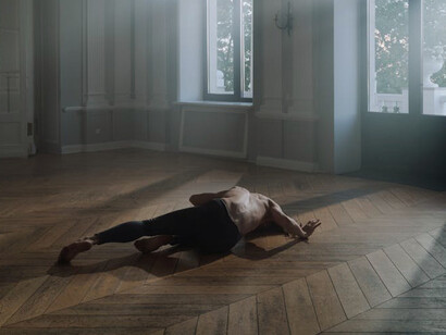 In a moment of exquisite balance, the dancer demonstrates how limits can serve as both a foundation and a catalyst for creativity and expression