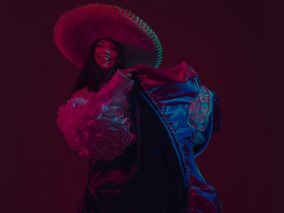 Experience the vibrant celebration of Cinco de Mayo with a stunning female dancer illuminated in neon purple lights, showcasing an energetic and festive atmosphere