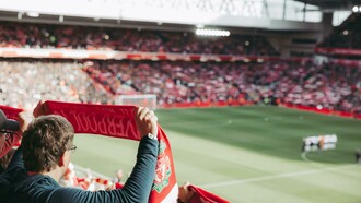 In Liverpool, England, United Kingdom, crowds gathered to watch the soccer game with passion and pride