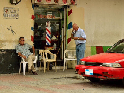 In Santo Domingo's vibrant streets, Friday evenings mean dominoes, laughter, friendship, and fun, creating a tapestry of community and competition