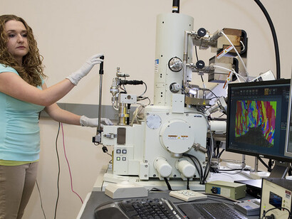 Scientist Nicole Overman conducts high-resolution electron microscopy studies of structural materials using the Scanning Electron Microscope (SEM) at Pacific Northwest National Laboratory
