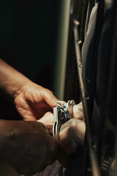 Handcuffs being tied to prisoner