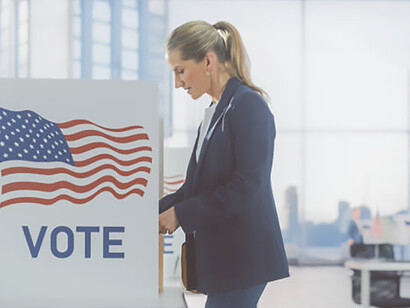 Patriotic Americans participate in the democratic process by visiting a polling station on Election Day in the United States