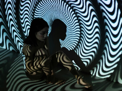 A woman, seemingly trapped in a vortex