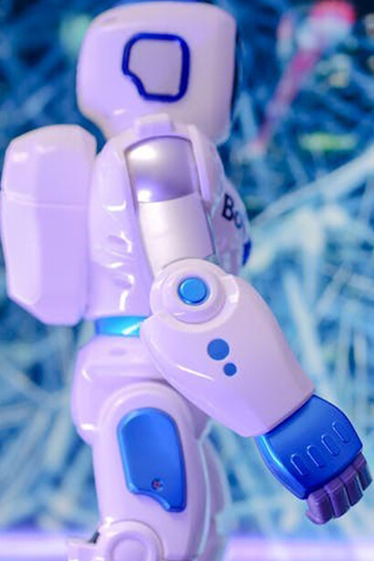 Dynamic humanoid robot walking on a vibrant blue background