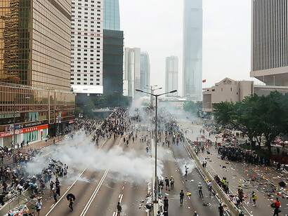 Police employ tear gas to scatter protesters outside the Legislative Council Complex on June 12, 2019, Hong Kong