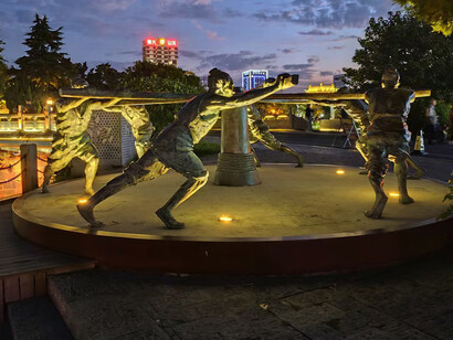 A monument to the hard working men who made the Grand Canal work, Jiangsu, China