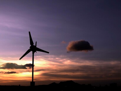 A solitary windmill in sunset can provide efficient energy