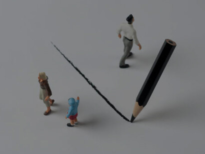 A line drawn from above divides a group of people from one another