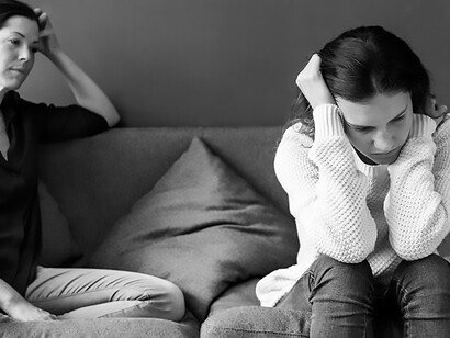In this emotional tableau, a mother and her teenage daughter engage in argument, the daughter visibly distressed and exhibiting signs of deep-seated unhappiness