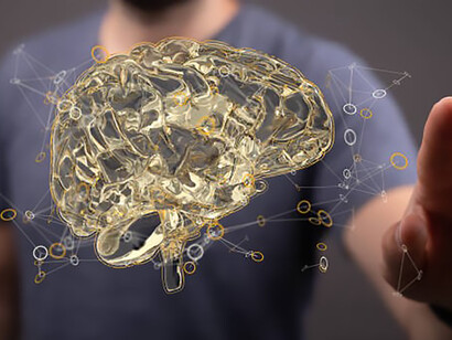 A detailed 3D-rendered brain is featured in close-up, with a man delicately reaching out to touch it
