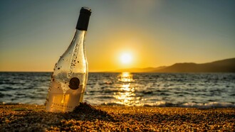 Wine on the sand, under the setting sun—the perfect beginning to a nostalgic and intimate night