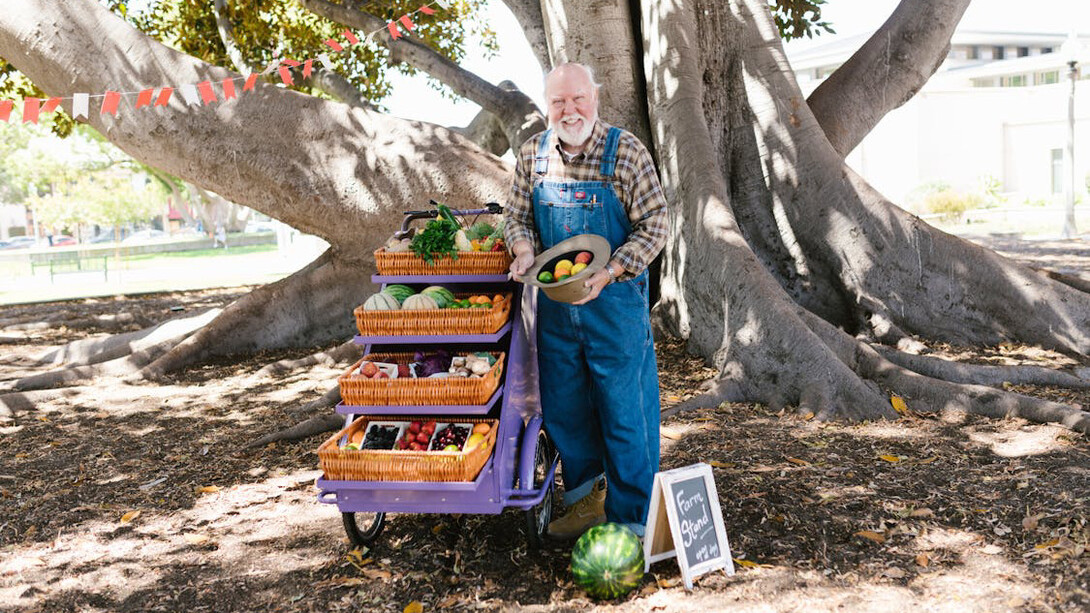 A farmer proudly displays his nutrient-rich harvest, showcasing nature's gifts for a healthier lifestyle