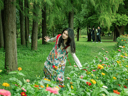 In the tranquil beauty of Yu Garden in Shanghai, China, the colourful flowers provide a picturesque backdrop to explore, to wander through the historic haven