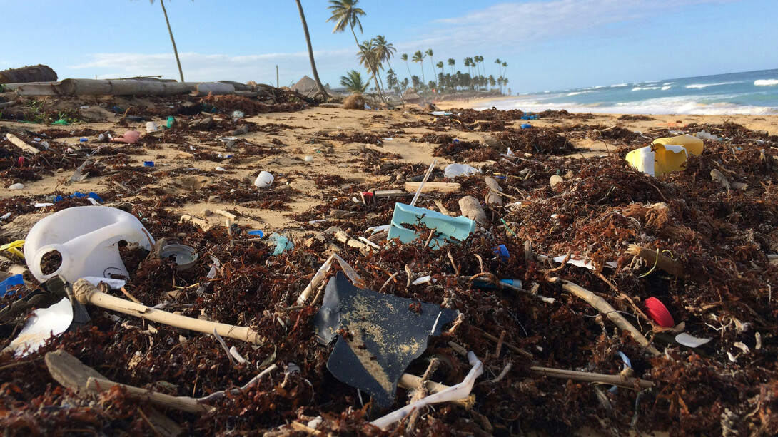 A tropical beach filled with garbage, experts say about 400 million metric tons of hazardous wastes are generated each year