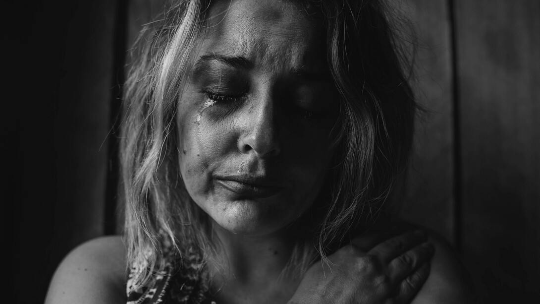 A woman in tears and going through a depression