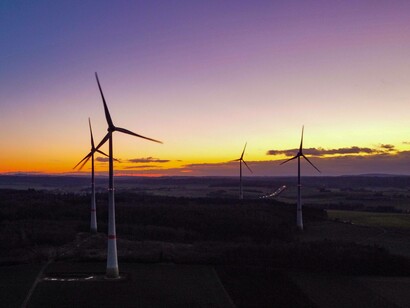 Windmills in the field provide an efficient energy source