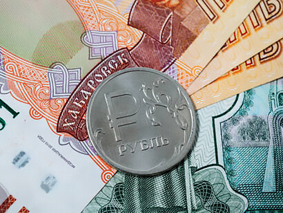 Banknotes and coins collectively embody Russia's ruble, providing a tangible representation of its economic decline