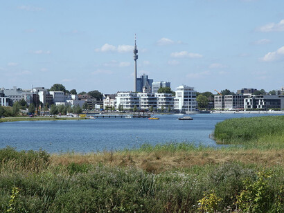 The scenic vista from Kaiserberg showcases the serene beauty of Phoenix Lake, surrounded by the picturesque landscape of Hörde in Dortmund, Germany