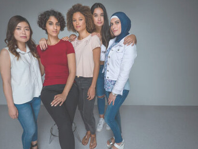 A diverse group of women from various backgrounds standing together, showcasing a spectrum of cultures