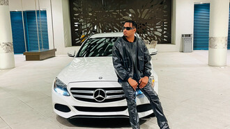 Gary Lewis blends style and and ambition in front of his Mercedes Benz