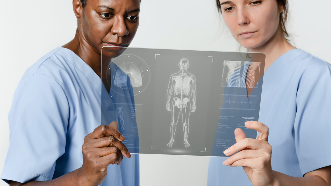Medical professionals analyzing a patient's X-ray image for accurate diagnosis and treatment planning