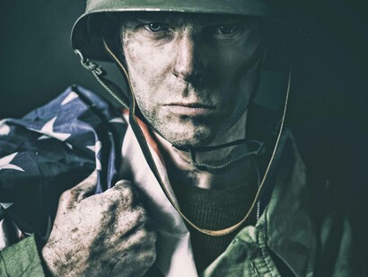 Soldier holding American flag