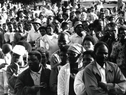 Voters of all races wait in queues at a voting station in Johannesburg, South Africa, during the country's first general elections on the 27th of April, 1994