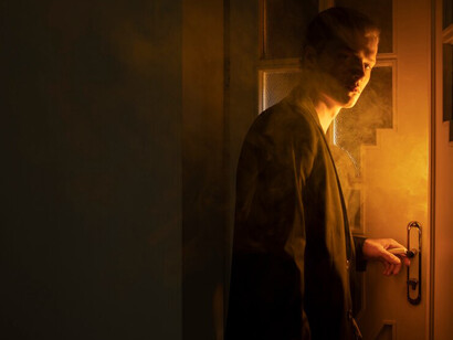 A striking side view of a man enveloped in smoke, evoking feelings of loneliness and reflecting on themes of individualism, depicted in a thought-provoking image