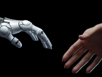 An AI robot hand reaches out towards a human hand