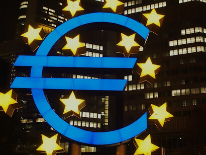 Euro symbol adorning the exterior of the European Central Bank building in Frankfurt, Germany, emblematic of the Eurozone's financial center