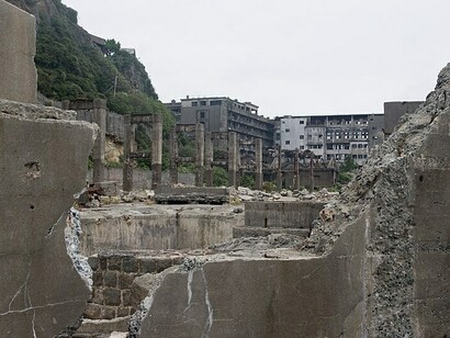 Hashima Island, or Gunkanjima, once a prosperous coal mining island off the coast of Japan, now stands in ruin, its ghostly, decaying structures silently narrating the rise and fall of industrial ambition